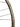 Close-up of a black bicycle wheel rim with the brand name PACENTI printed vertically in white, alongside thin black spokes and a blurred indoor workshop background.